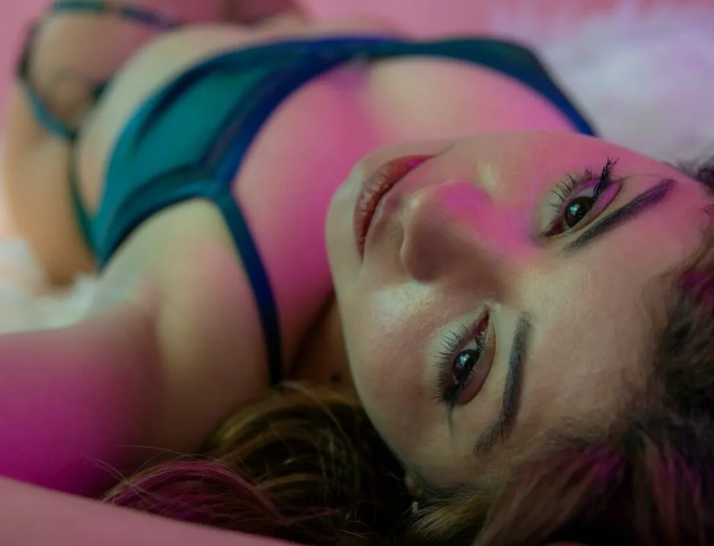 seductive-lying-woman-on-bed